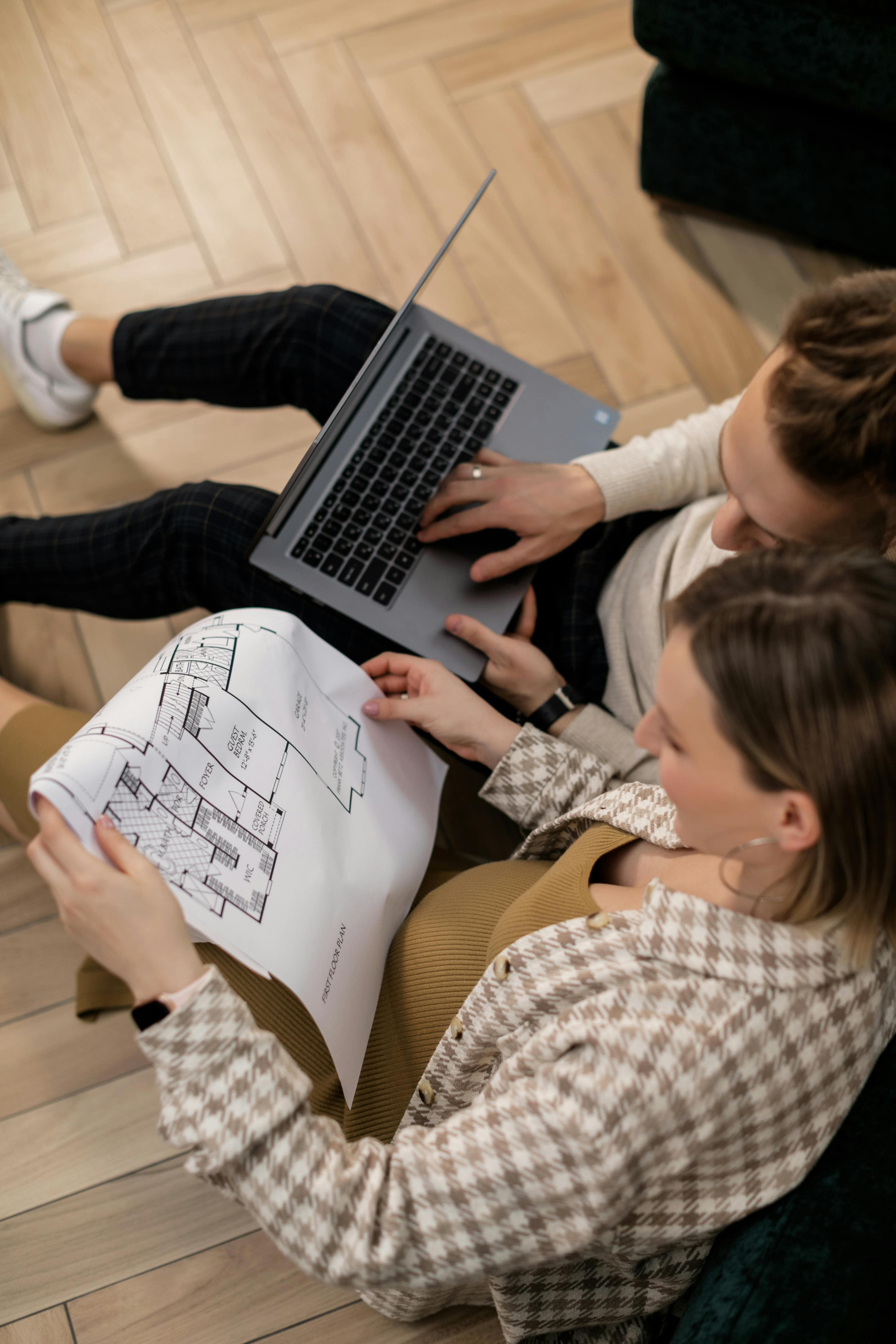Homebuyers reviewing plans during project coordination